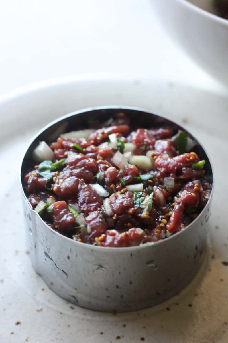 pressing bison meat in to the mold