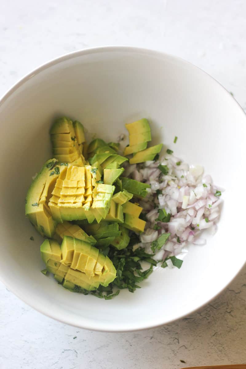 chopped vegetables in the white bowl